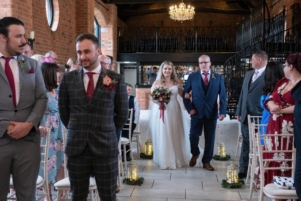 Josh waiting nervously at the altar