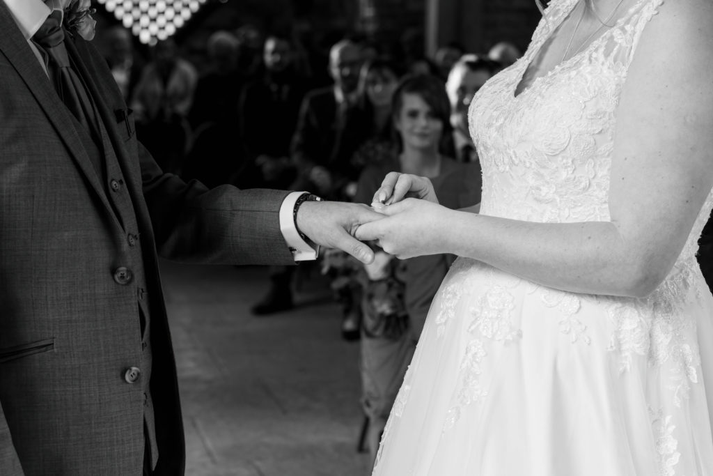 Exchange of rings in the barn’s candlelit ceremony space