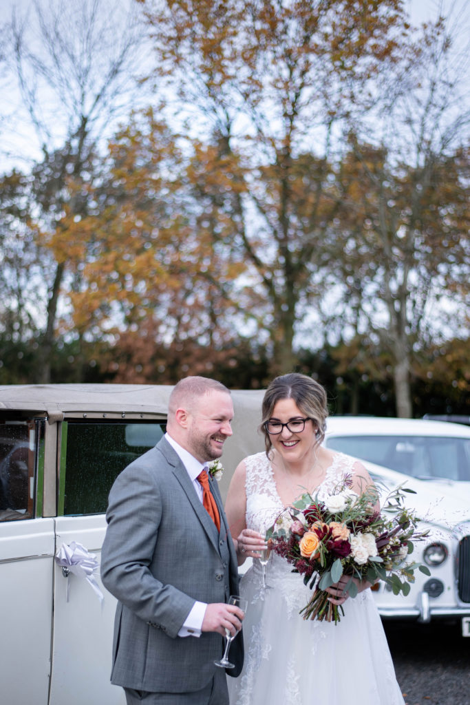 Natural wedding photography of the bride holding bouquet
