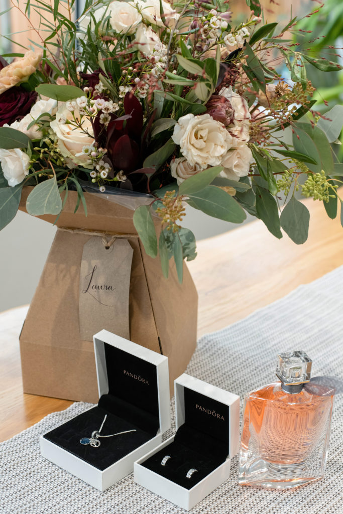Close-up of cream and red bridal bouquet from The Lanes Lifestyle