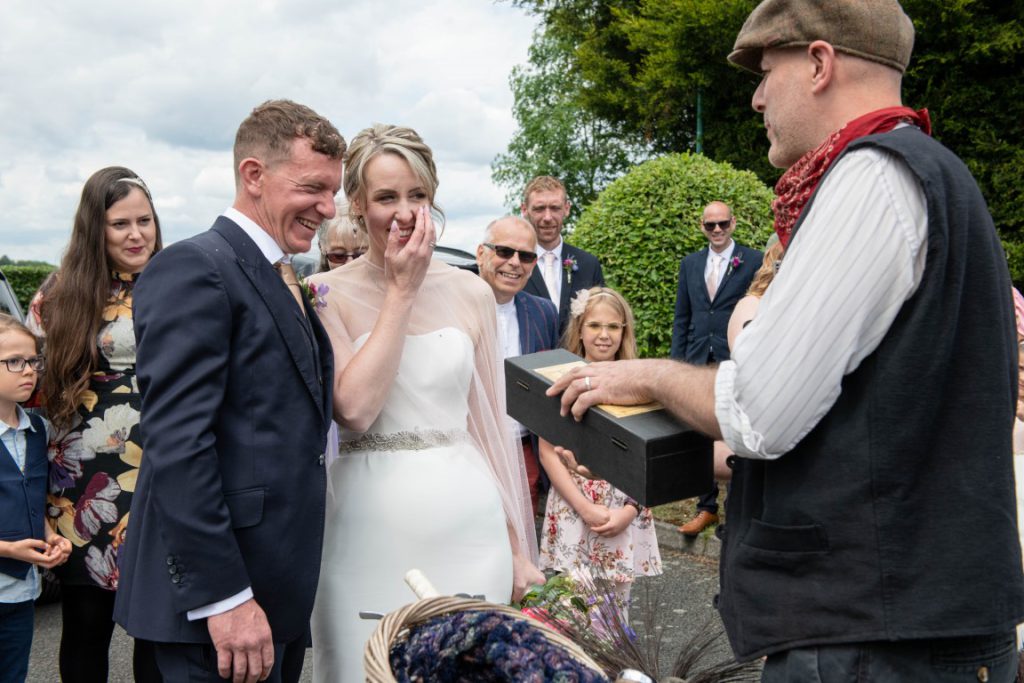 Lucky chimney sweep surprising the bride at colourful wedding