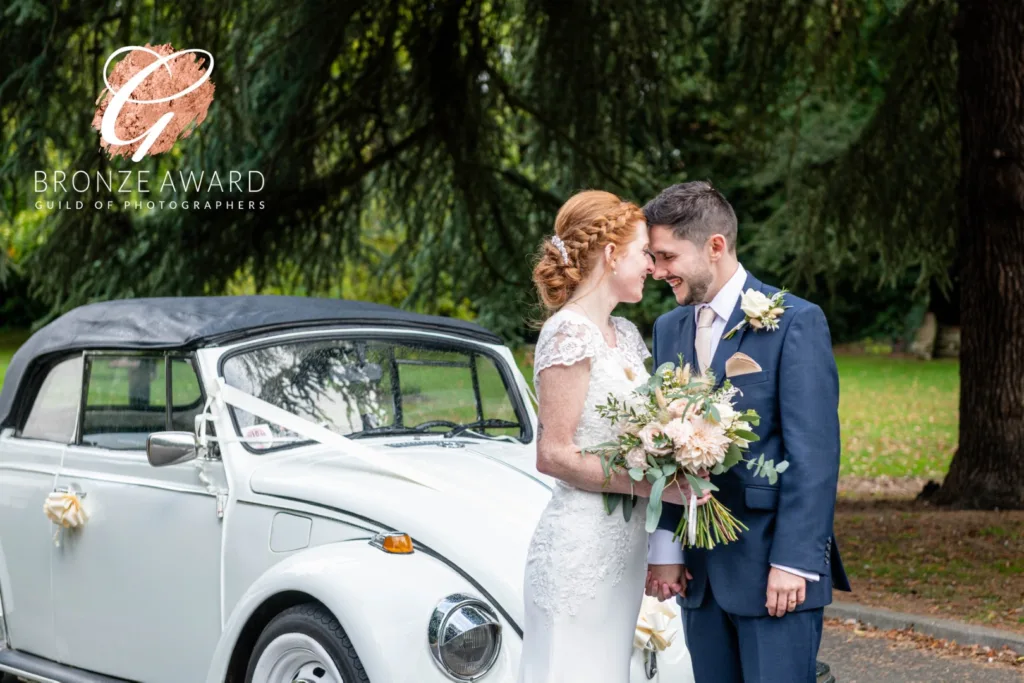 Wedding Photography Portfolio – bride and groom with vintage car in front of stately home